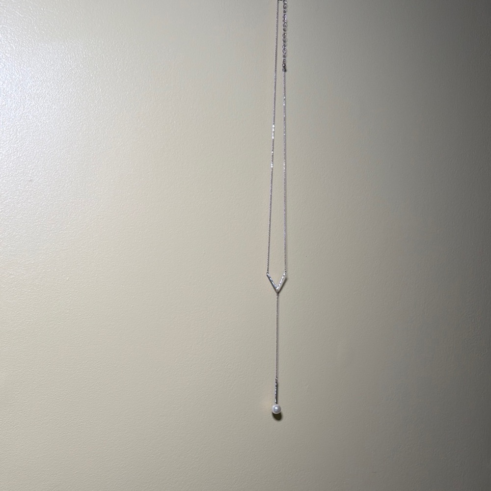 Elegant Silver Necklace with Long Chain and Dark Pendant
